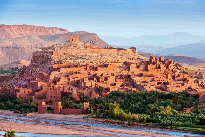 The UNESCO-listed fortified village of Ksar Ait Ben Haddou at sunset on Day 6 of this 8 days in Morocco itinerary.
