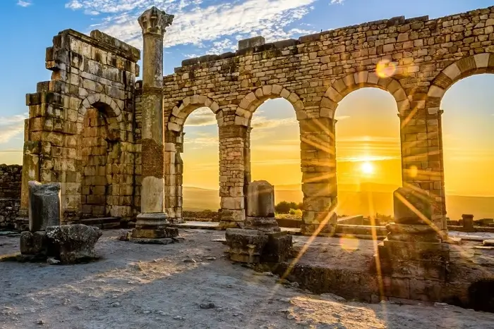 Ancient Roman ruins of Volubilis at sunset on a 10 day Morocco trip