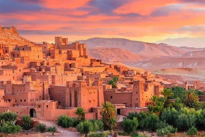 UNESCO listed Ksar Ait Benhaddou at sunset on a Morocco honeymoon packages tour