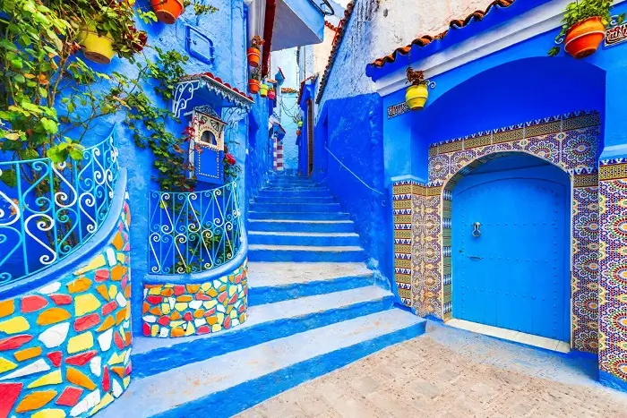 Blue painted alley and traditional houses in Chefchaouen, Morocco's Blue City during a 15 Day Morocco Tour